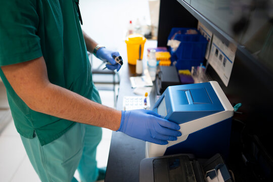 Lab technician works with equipment in a lab