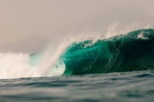 Ocean water surges and collapses in massive breaking waves