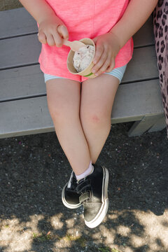 Child's legs with ice cream