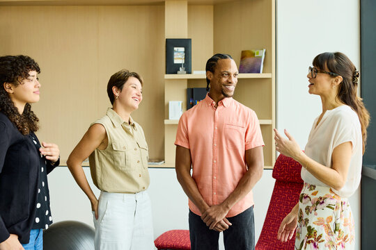 Boss and employees at business office.