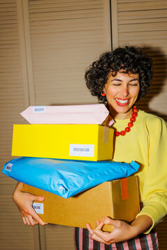 Woman receiving many packages from online shopping ugc