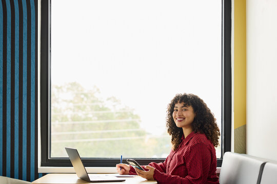 Portrait of Businesswoman at Desk smiling