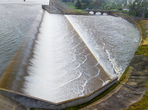 Patterns in water flowing over tiers a ofreservoir spillway