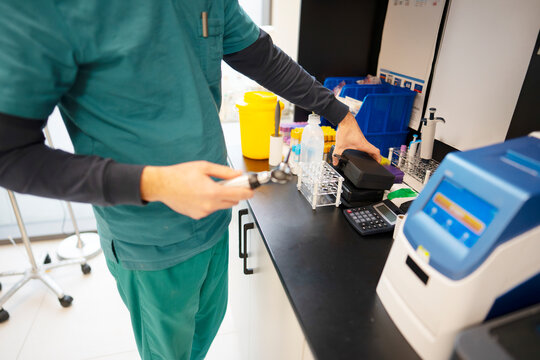 Medical technician prepares equipment for testing