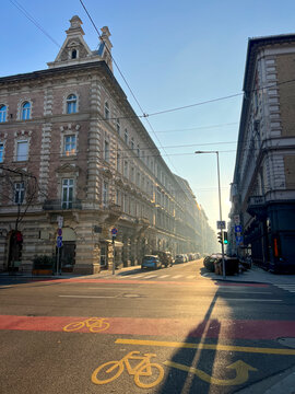 Budapest street showing classic architecture and bike lane at sunset