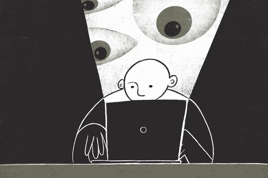 Man working on a laptop in the dark room and eyes watching him