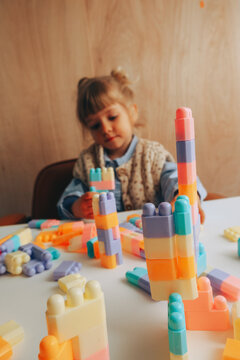 Toddler girl playing with blocks