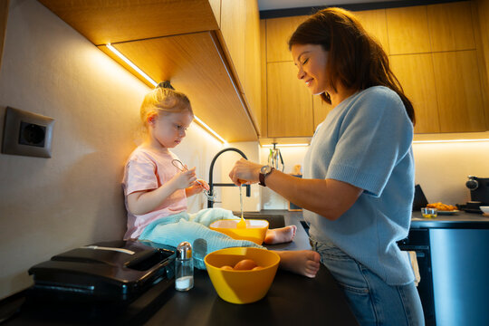 Child Helping Mix Ingredients at Home
