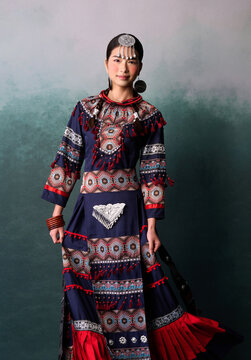 Chinese woman wearing traditional Zhuang ethnic attire.