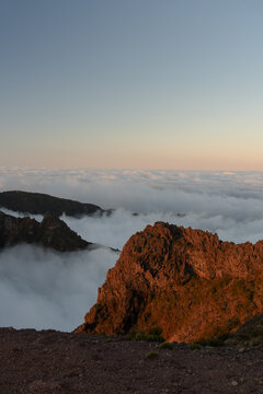 Rocky peak rising above cloud layer Madeira