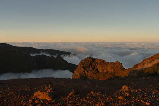 Mountain peaks above clouds at sunrise Madeira