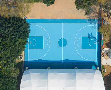 Aerial Top View of Vibrant Blue Outdoor Basketball Court