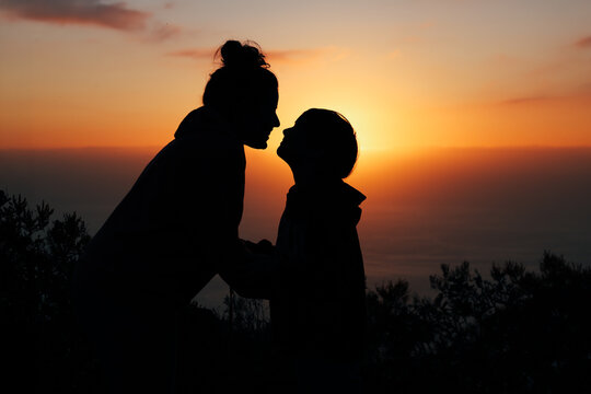 Silhouette couple kissing at sunset in La Palma, Canary Islands