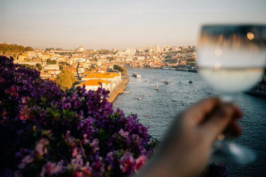 Enjoying a Drink While Looking at the River and Cityscape