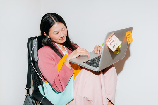 Asian Woman Working on Laptop With Sticky Notes With White Background