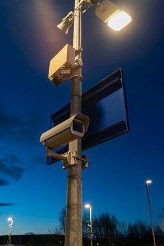CCTV Device on Pole With Blue Sky and Clouds at Sunrise