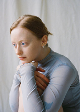 Portrait of a young girl with blue eyes in a studio 