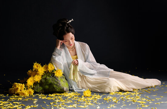 Chinese woman wearing traditional ancient Hanfu, with chrysanthemums