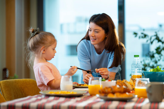 Mother and daughter share a meal