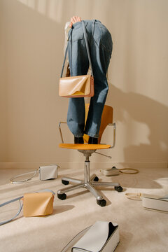 Fashion Handbag Styled With Jeans On Chair