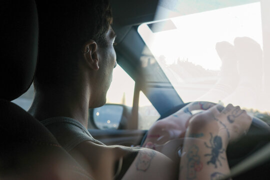 Driver and Legs of Passenger in a Car