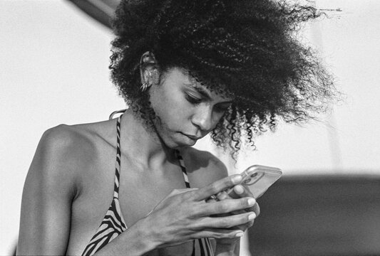 Checking Phone in Sunlight