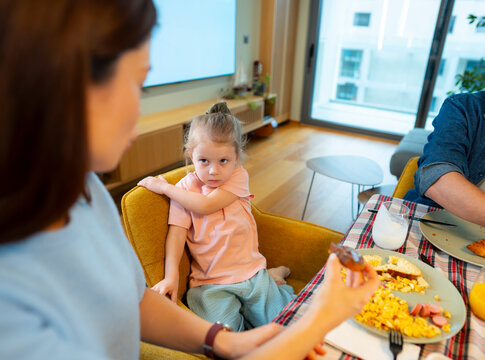 Child Refusing Food At Table