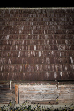 Wooden bricks as roofing on a wooden hut