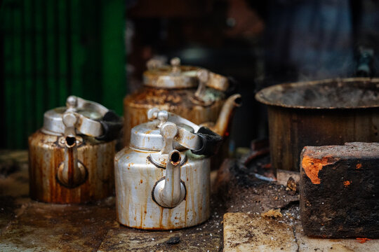 Old metal kettles at a street tea stall