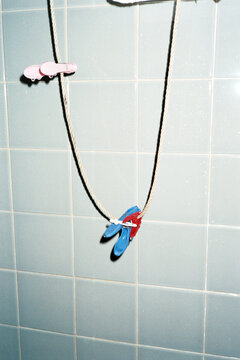 Colorful Clothespins on Line in Bathroom with Direct Flash