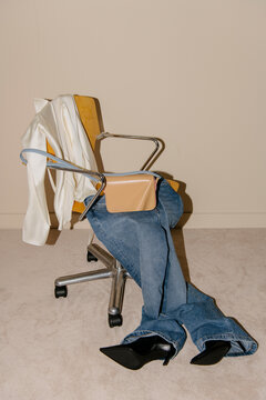 Empty Outfit Draped Over Office Chair