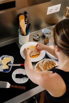 Young woman preparing classic Spanish torrijas