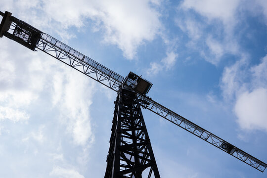 Tower crane against blue sky