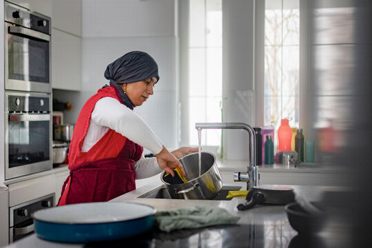 Housewife Washing Dishes