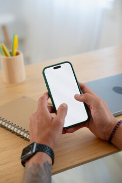 Close Up of Smartphone with Blank Screen in Hands