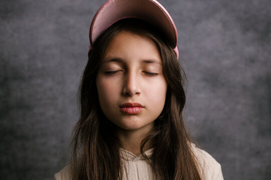 Girl with eyes closed meditating for tranquility