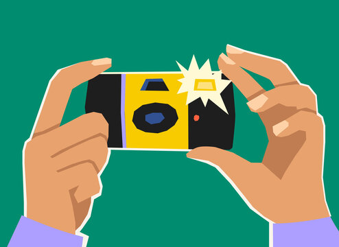 Hands holding camera taking photo flash photography concept
