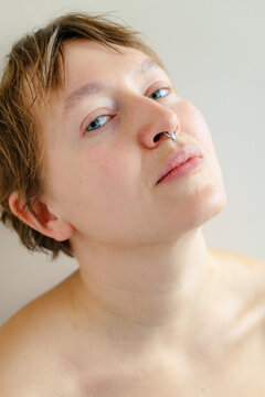 Close up portrait of curvy woman looking at camera in natural light
