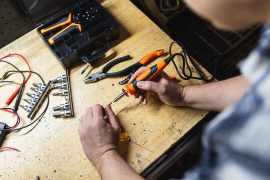 Technician Soldering Electronic Components
