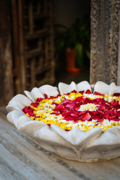 Floating Flower Petals in Stone Bowl
