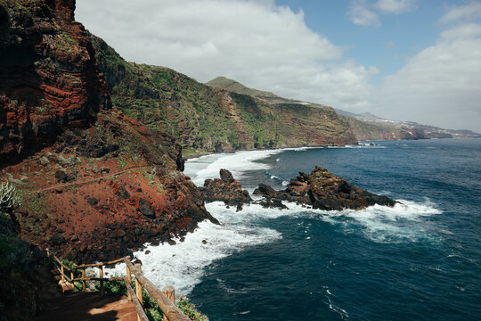 Rugged volcanic coast and surf at Playa de los Nogales