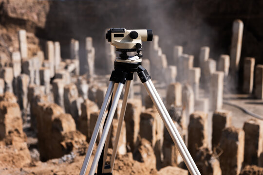 Surveying level on construction site