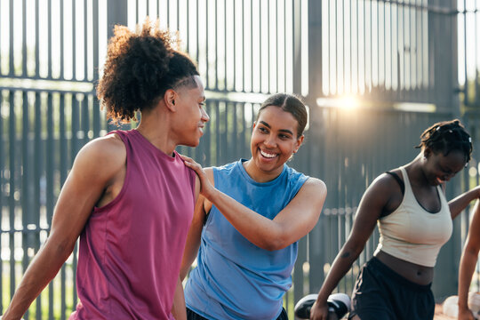 Group exercise in outdoor setting promotes teamwork