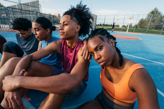 Diverse group relaxing after basketball game