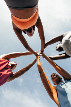 Unity and teamwork under a clear blue sky