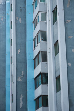 Blue and Gray Apartment Windows in Sharp Diagonal Composition