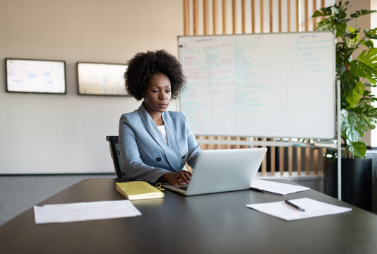African American businesswoman using laptop