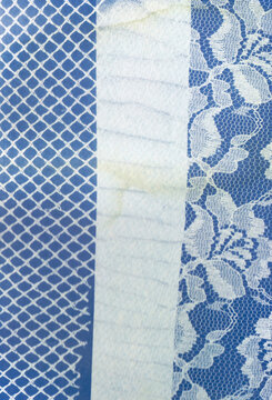 Blue grid, textured white fabric, and floral lace patterns
