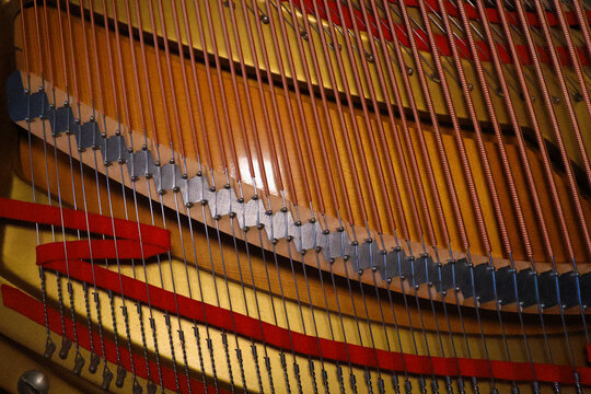 Top view over the strings of a classical opened grand piano