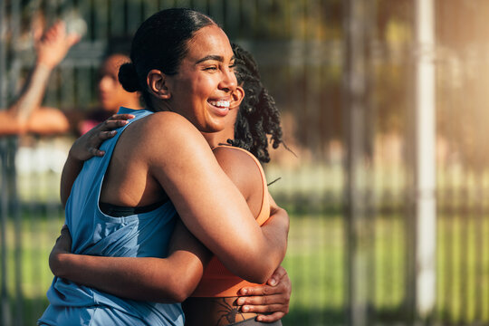 Joyful outdoor hug between two friends